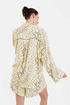 Woman wearing a floral lace dress on a white background