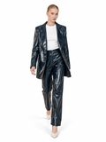 Love And Alicia Sailor navy vinyl trousers, walking front view showing the glossy straight-leg cut