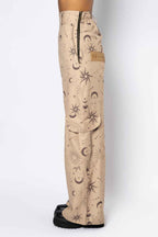 Beige pants with celestial pattern on a white background