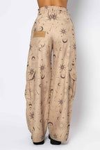 Beige pants with celestial pattern on a white background
