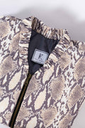 Partial view of a snake-print jacket with a black zipper and a "Kiss the Designer" tag.