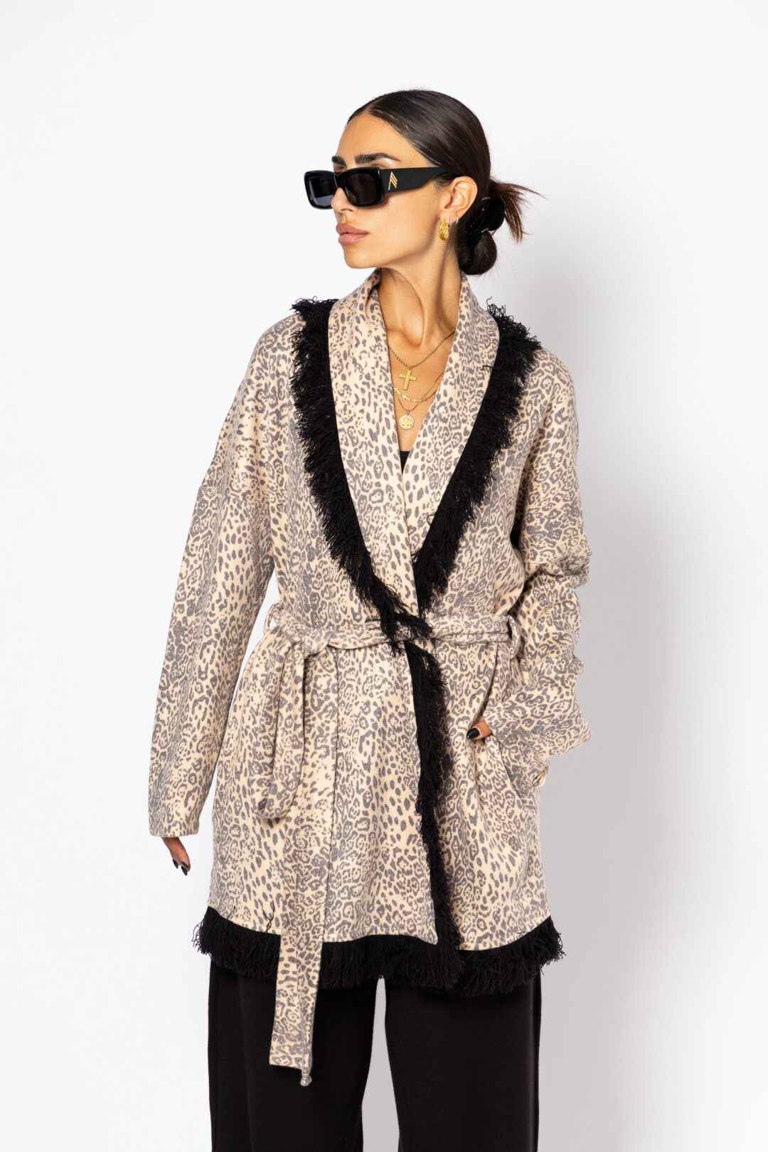 Knitted leopard print jacket with black fringes.