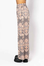 Patterned pants worn by a mannequin on a white background