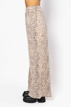 Long floral skirt worn by a person on a white background