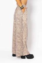Leopard print skirt worn by a person on a white background
