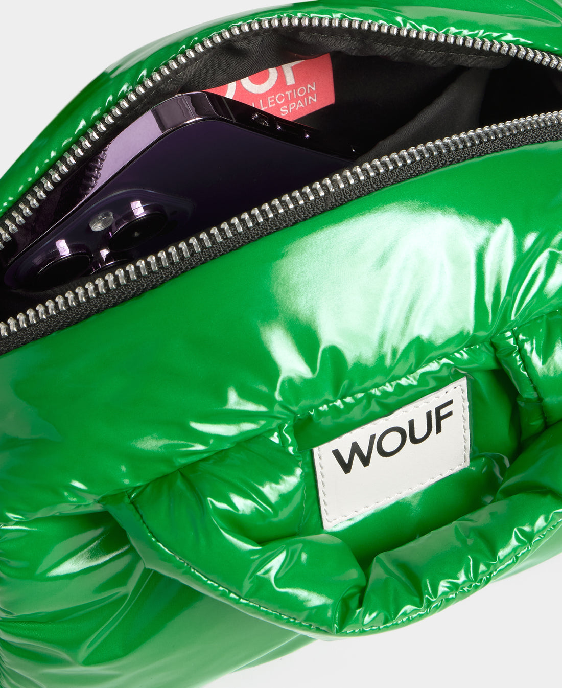 Green reflective pouch with a visible 'WOUF' brand label on a white background