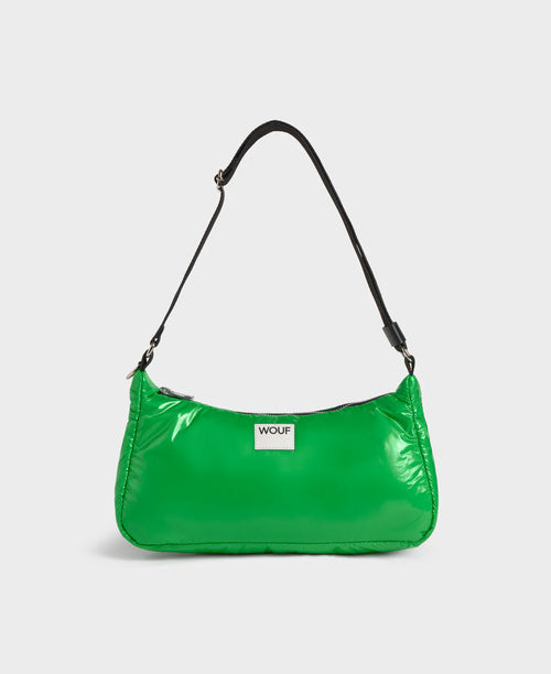 Green handbag with a visible brand logo on a white background