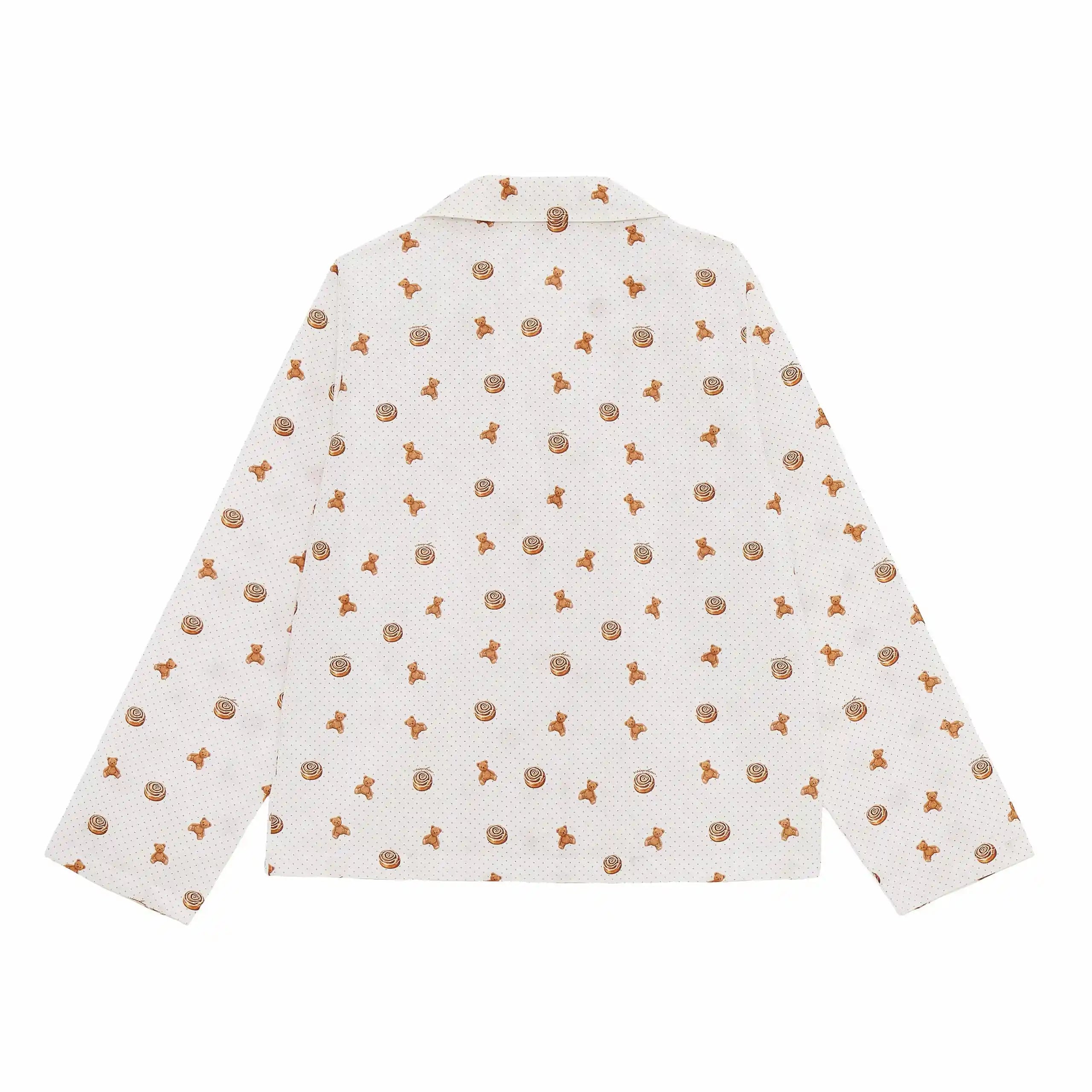 White shirt with small brown patterns on a white background