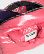 Pink puffer bag with 'WOUF' branding on a white background