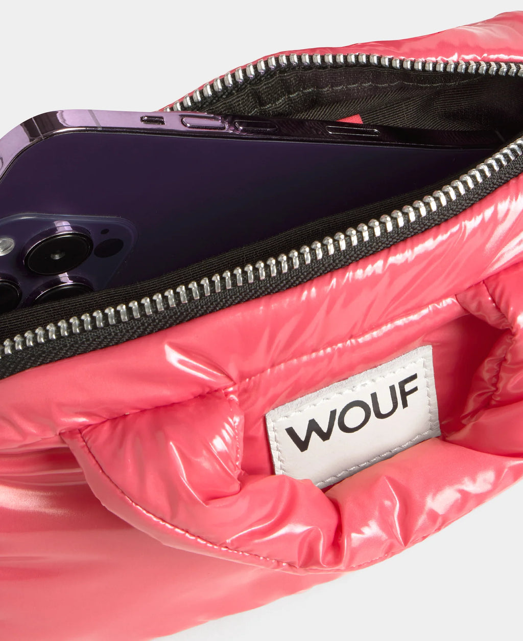 Pink glossy pouch with a phone inside and 'WOUF' brand label.