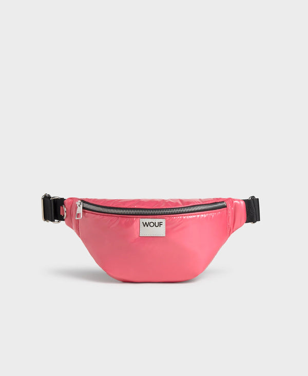 Pink waist bag with a visible brand logo 'Wouf' on a light gray background
