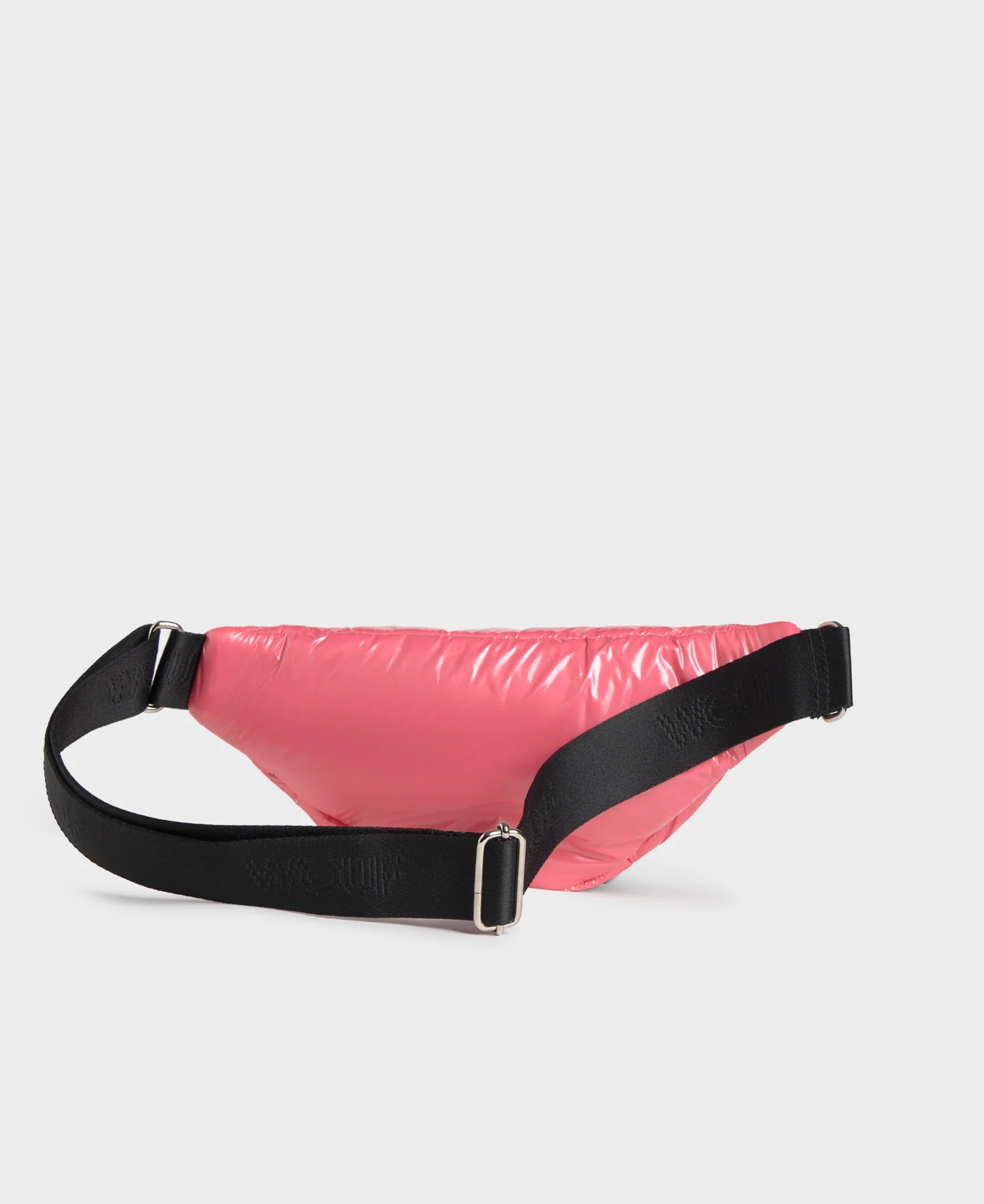 Pink waist bag with black strap on a light gray background