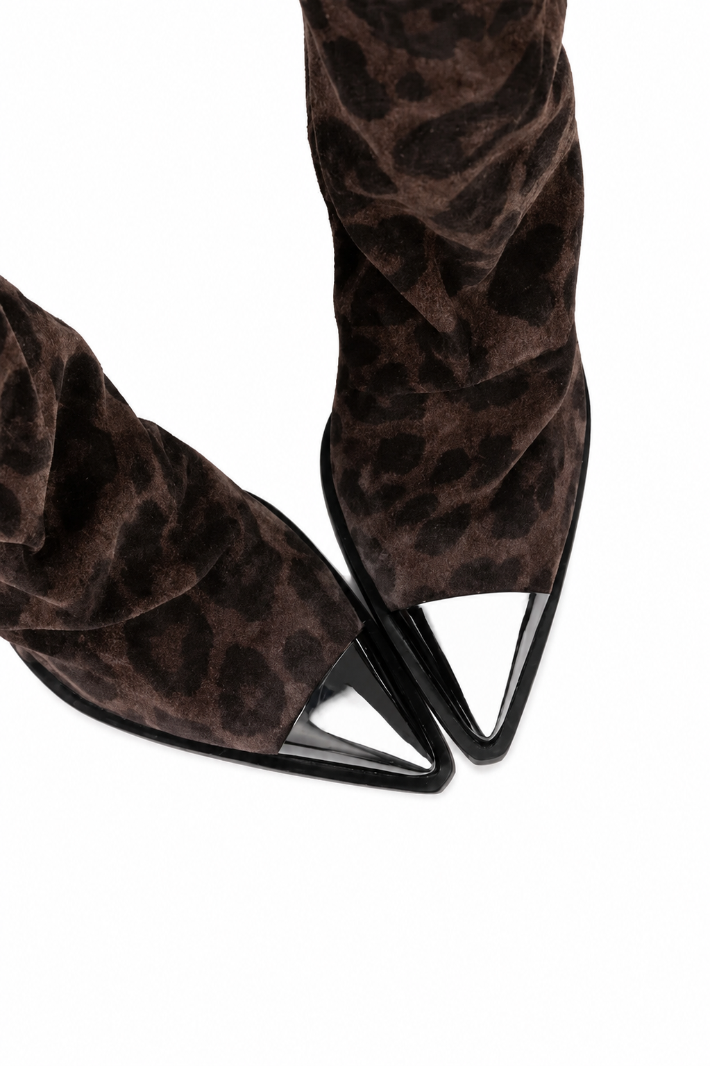 Close-up of a pair of pointed-toe boots in dark brown leopard-print suede with glossy black pointed toe caps, shown on a white background.