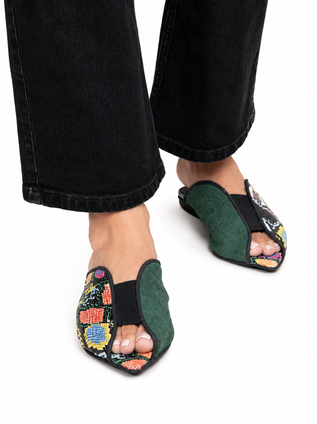Sandalista Cap Multi flat leather mules with multicolour snake print and green suede cap toe worn with cuffed black jeans front view