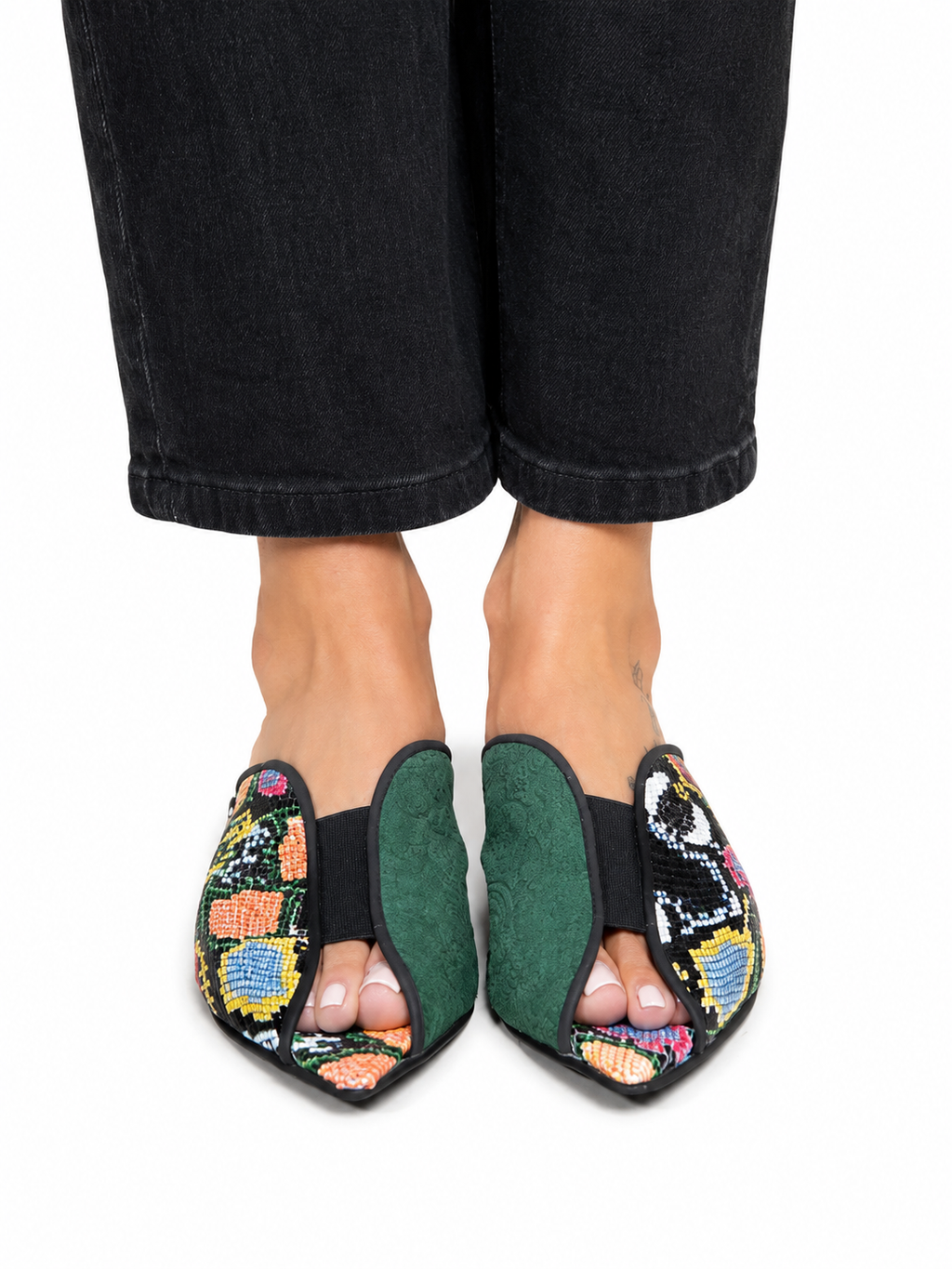 Sandalista Cap Multi flat leather mules with multicolour snake print and green suede cap toe worn with wide-leg black jeans overhead view