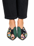 Sandalista Cap Multi flat leather mules with multicolour snake print and green suede cap toe worn with wide-leg black jeans overhead view