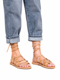 Sandalista Amazona tan leather lace-up sandals with ankle wrap ties worn with cuffed blue jeans front view
