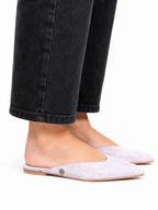 Sandalista Brocade Gray flat leather mules with pointed toe and open back worn with cuffed black jeans side view