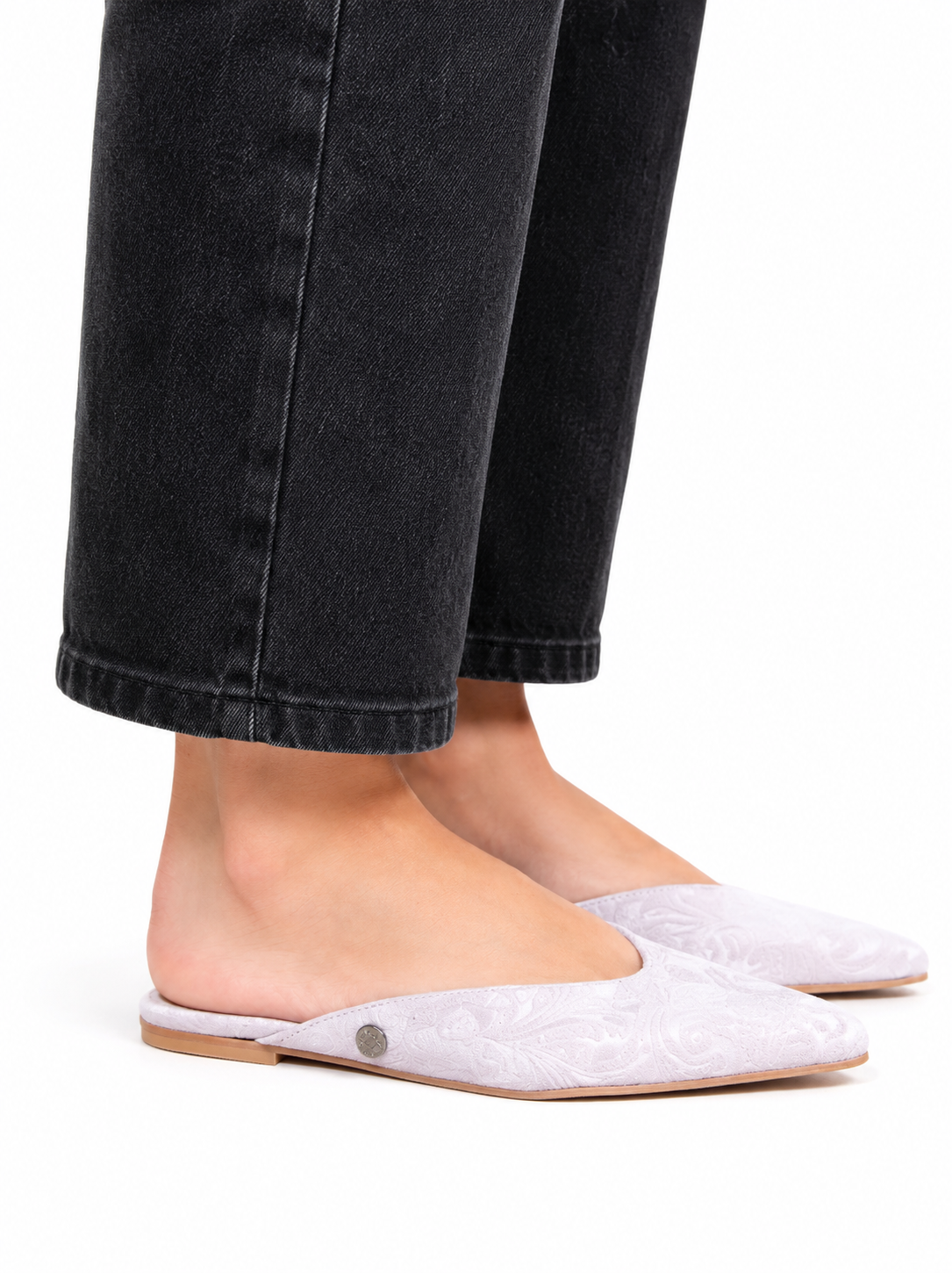 Sandalista Brocade Gray flat leather mules with pointed toe and open back worn with cuffed black jeans side view