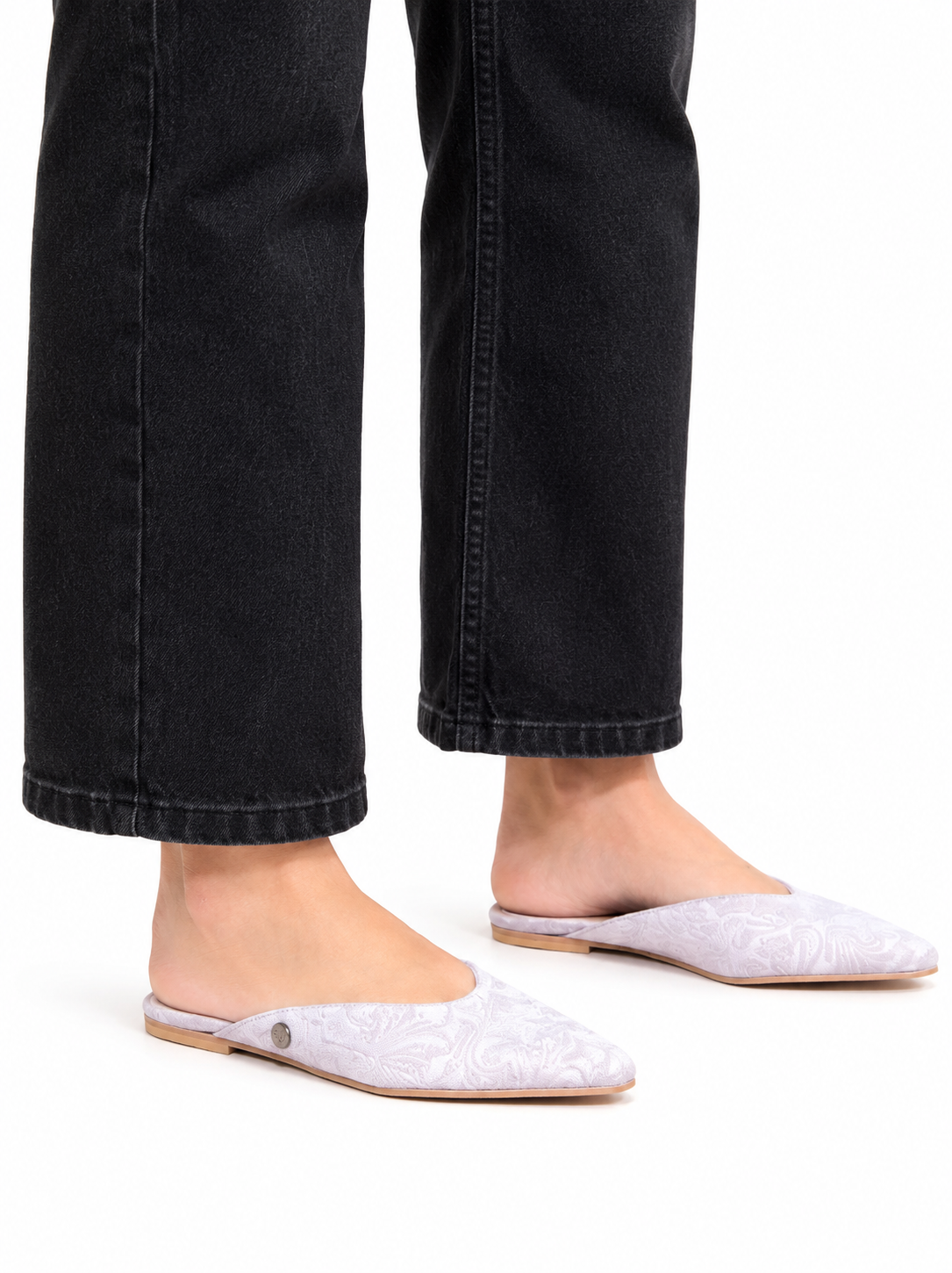Sandalista Brocade Gray flat leather mules with pointed toe and open back worn with black wide-leg jeans front view