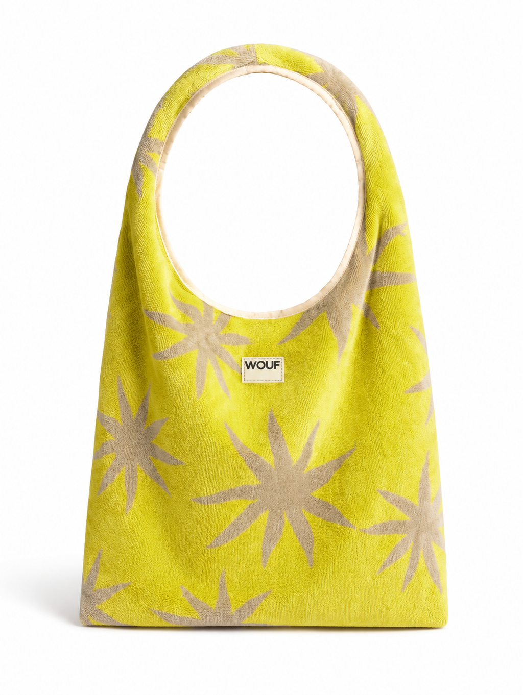 WOUF Fuerteventura T-Shirt Bag in yellow-green terry cloth with beige star print and silicon label on white background