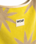 WOUF Fuerteventura T-Shirt Bag close-up of yellow-green terry cloth texture with beige star print and silicon WOUF label detail