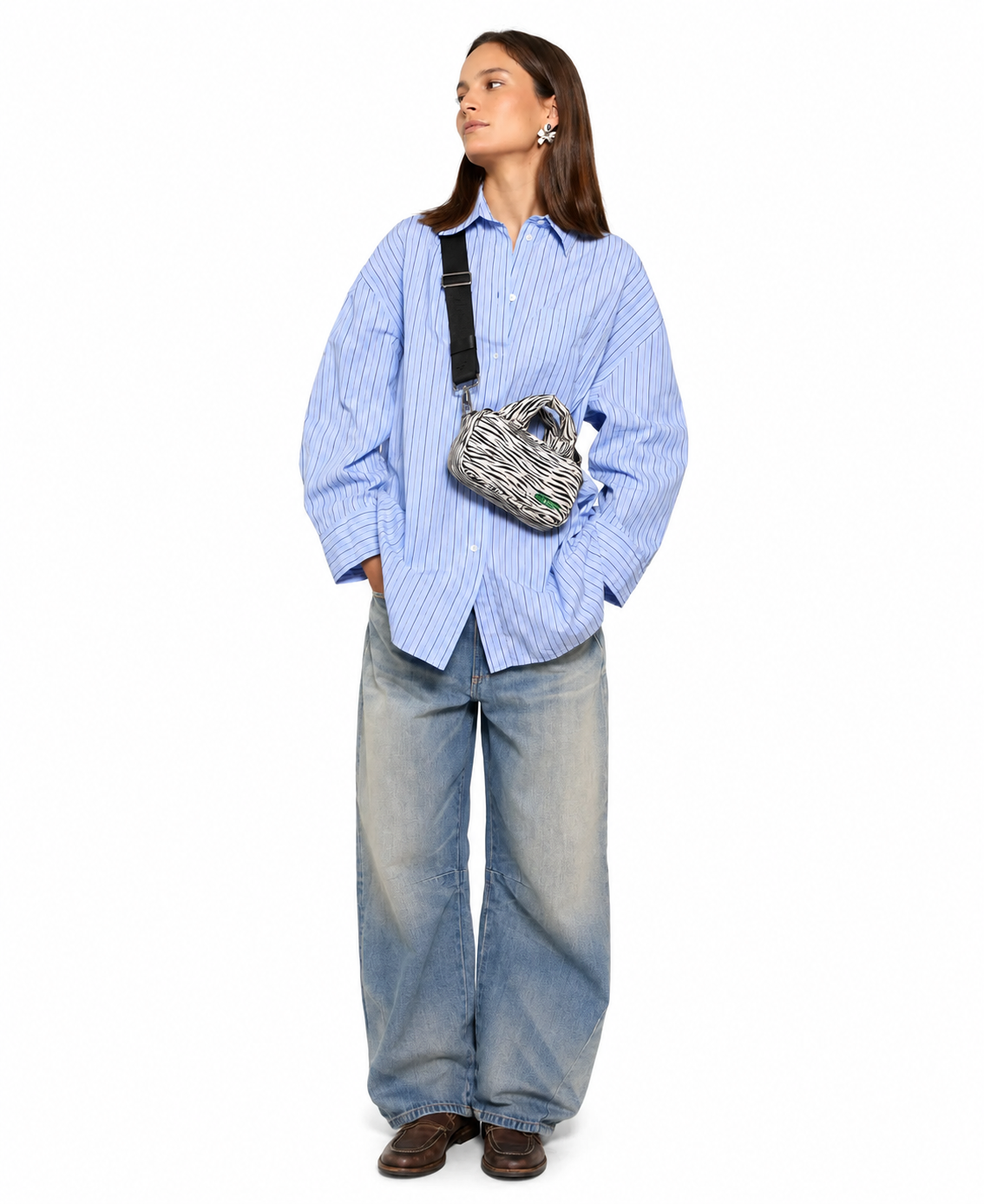 WOUF Zebra Hit Mini Bag worn crossbody over blue striped oversized shirt and wide-leg jeans