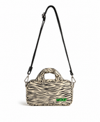 WOUF Zebra Hit Mini Bag in black and white zebra print with green logo embroidery and black crossbody strap on white background