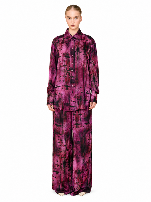 Love And Alicia ERIS magenta and black printed satin shirt with an oversized fit, worn with matching trousers