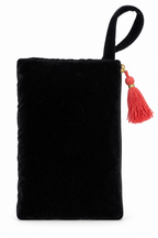 A black velvet clutch bag with a top handle and a red tassel zipper pull, shown against a plain white background.