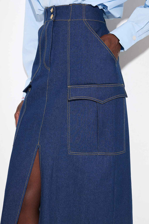 Blue denim skirt with a front slit on a white background 