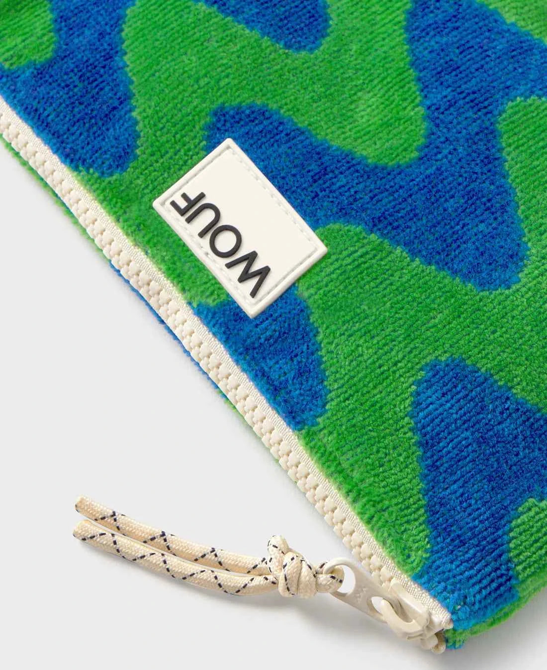 Dog toy with a camouflage pattern and a visible brand logo on a white background