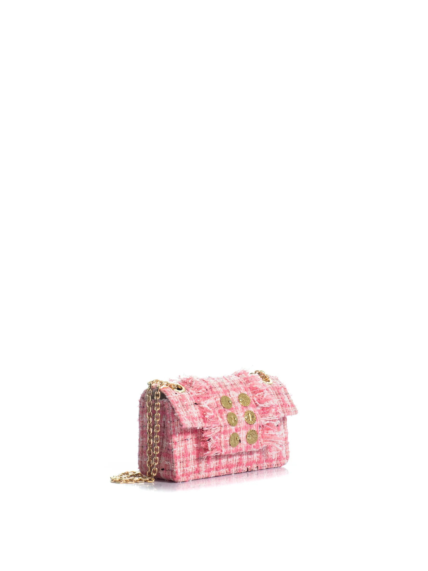 Pink checkered handbag with gold accents on a white background