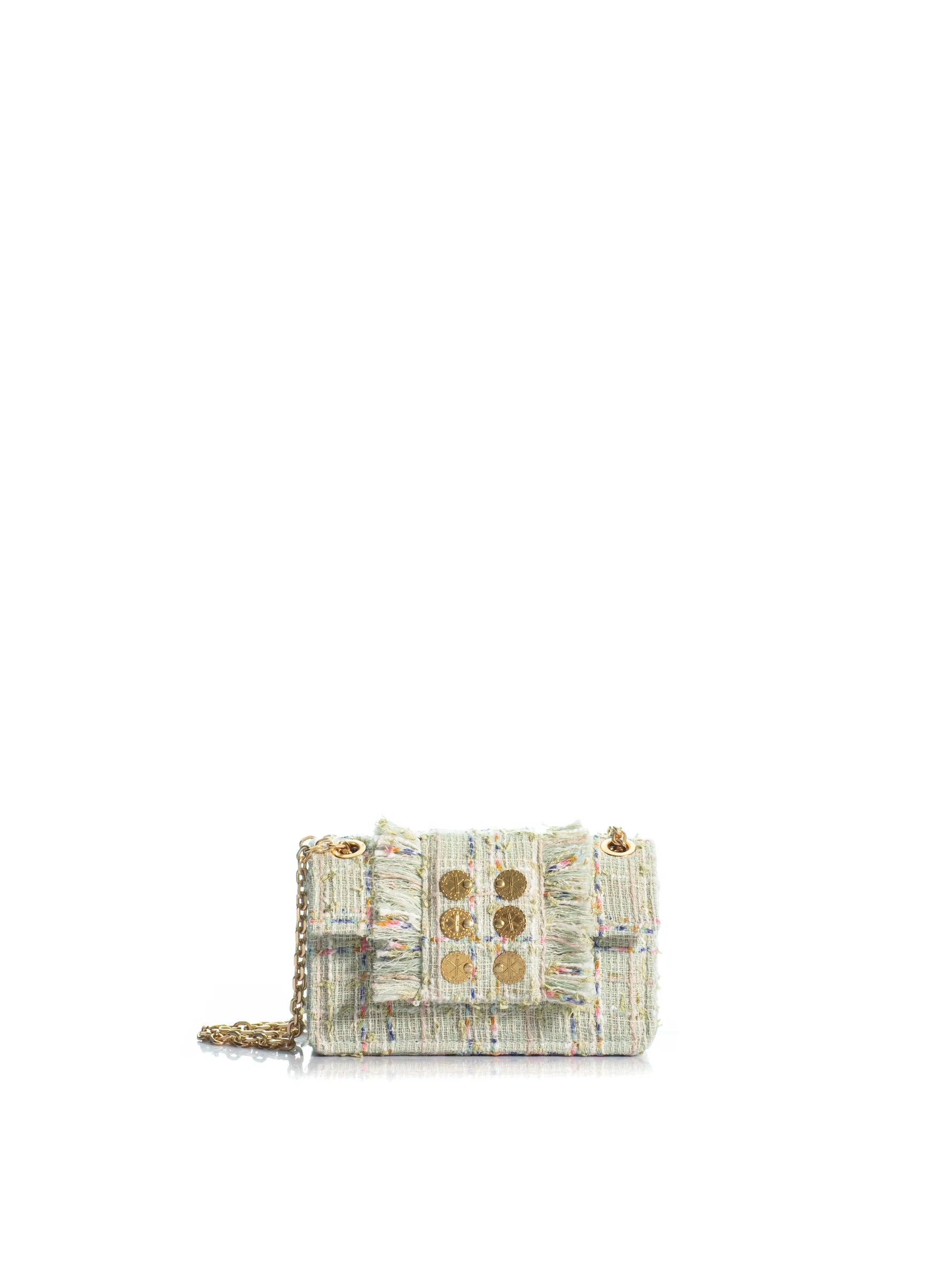 Textured handbag with gold accents on a white background