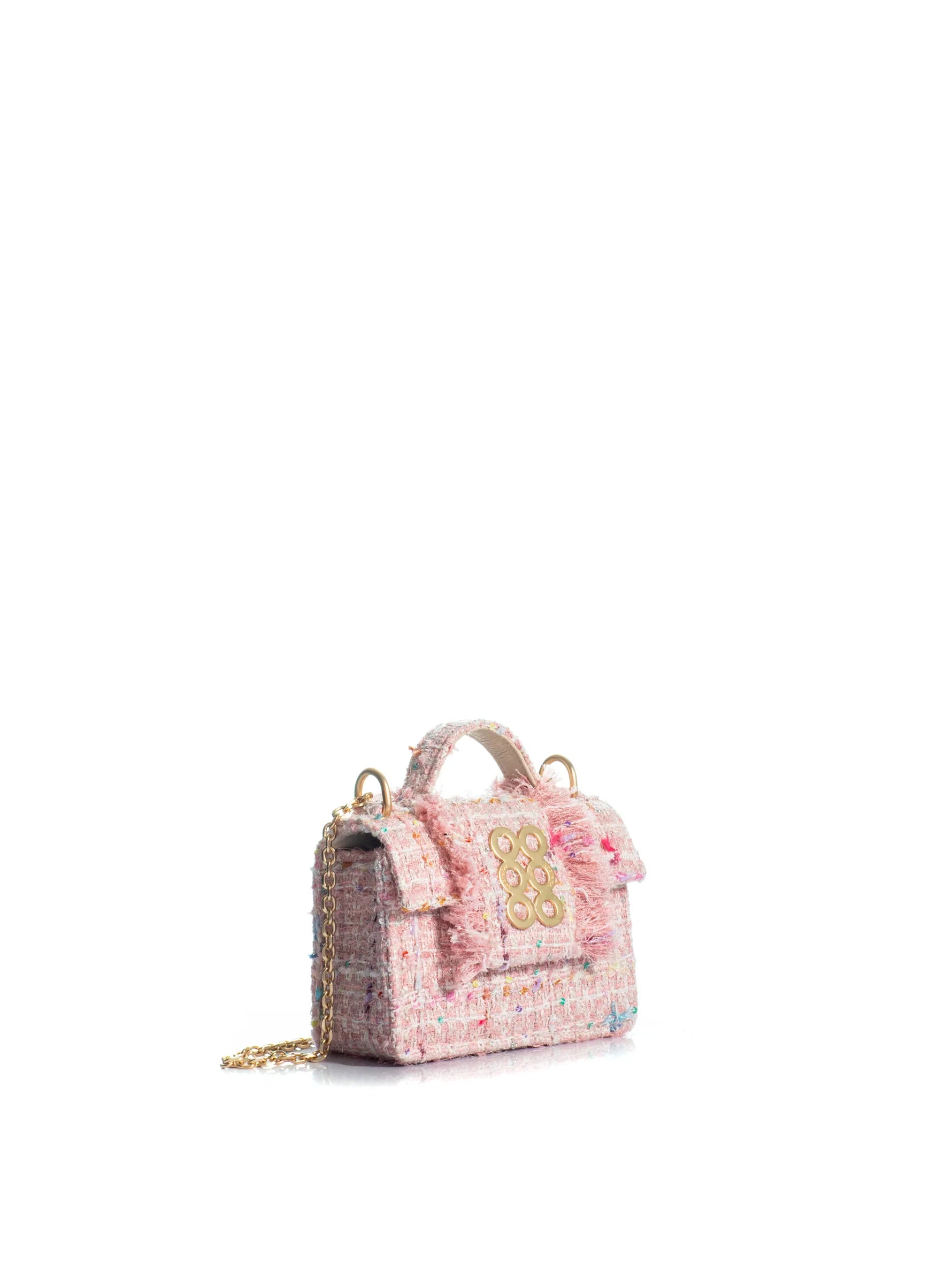 Pink textured handbag with floral details on a white background