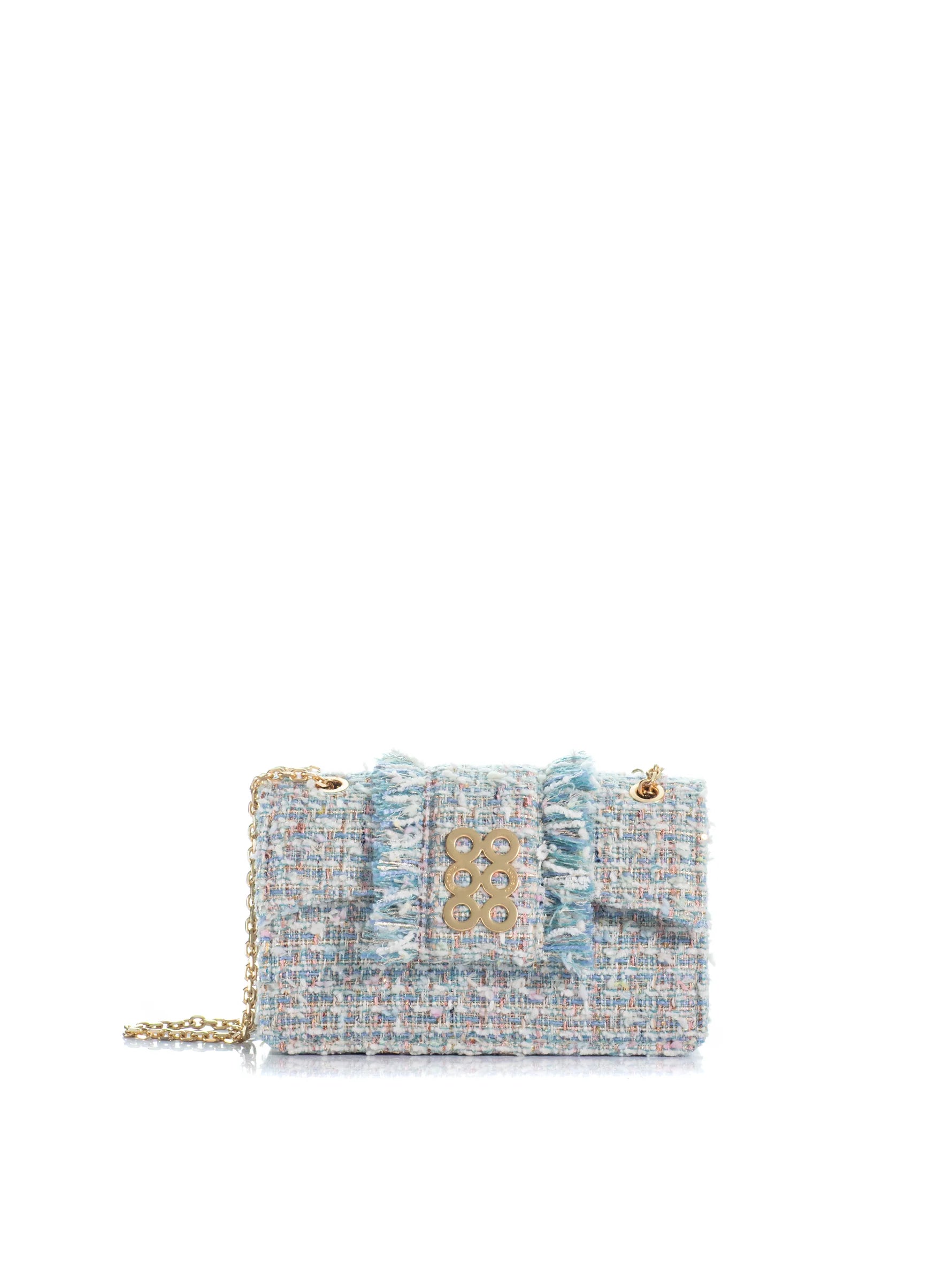 Tweed handbag with gold chain on a white background