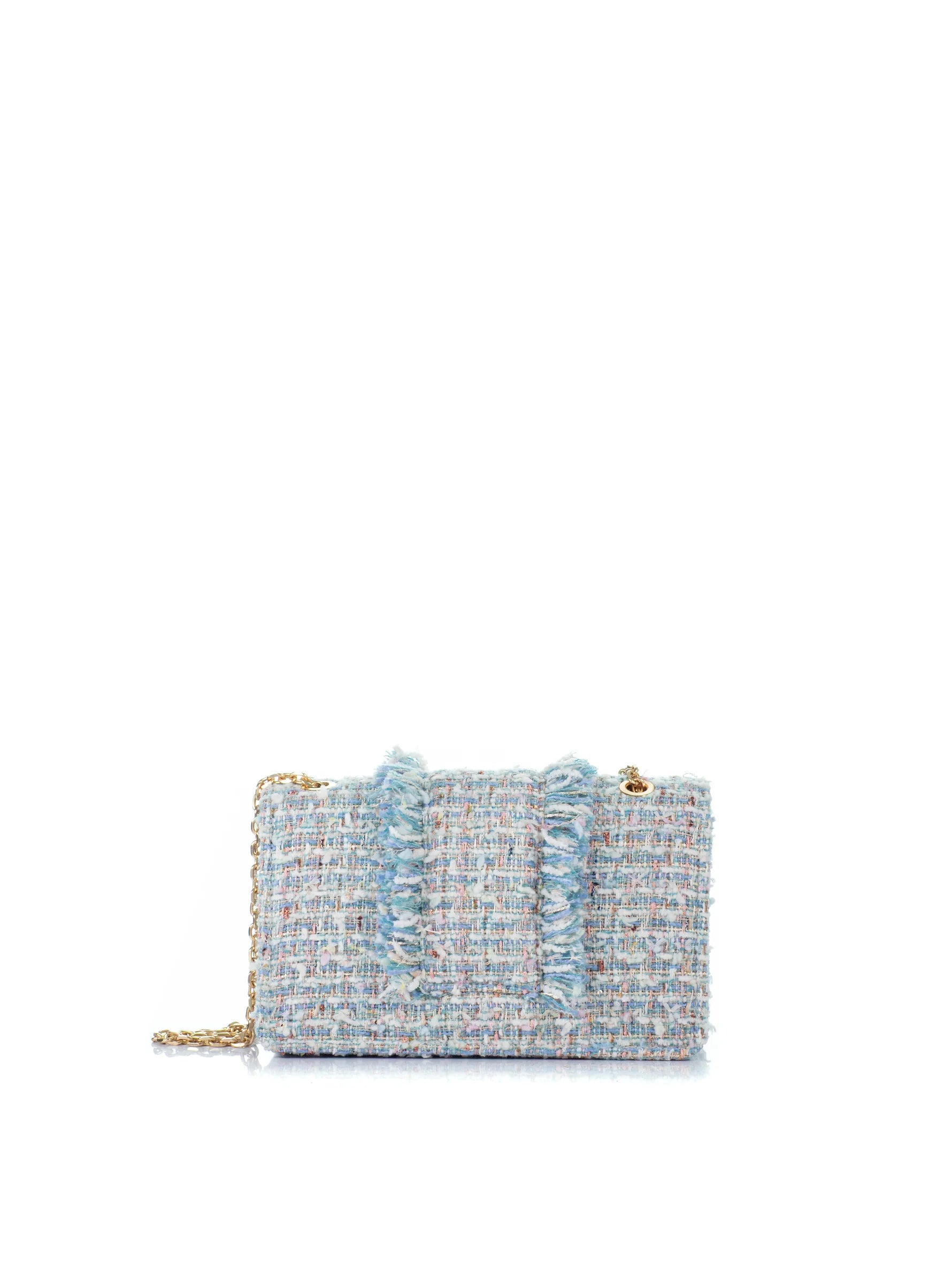 Multicolored tweed clutch bag on a white background