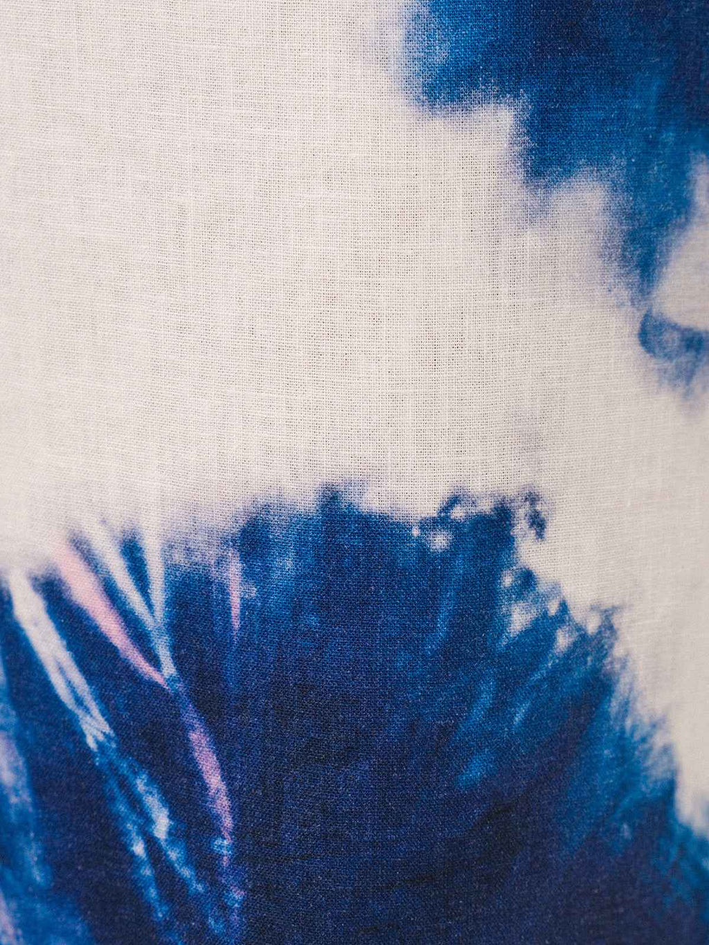 Close-up of tie-dye fabric with blue and white patterns