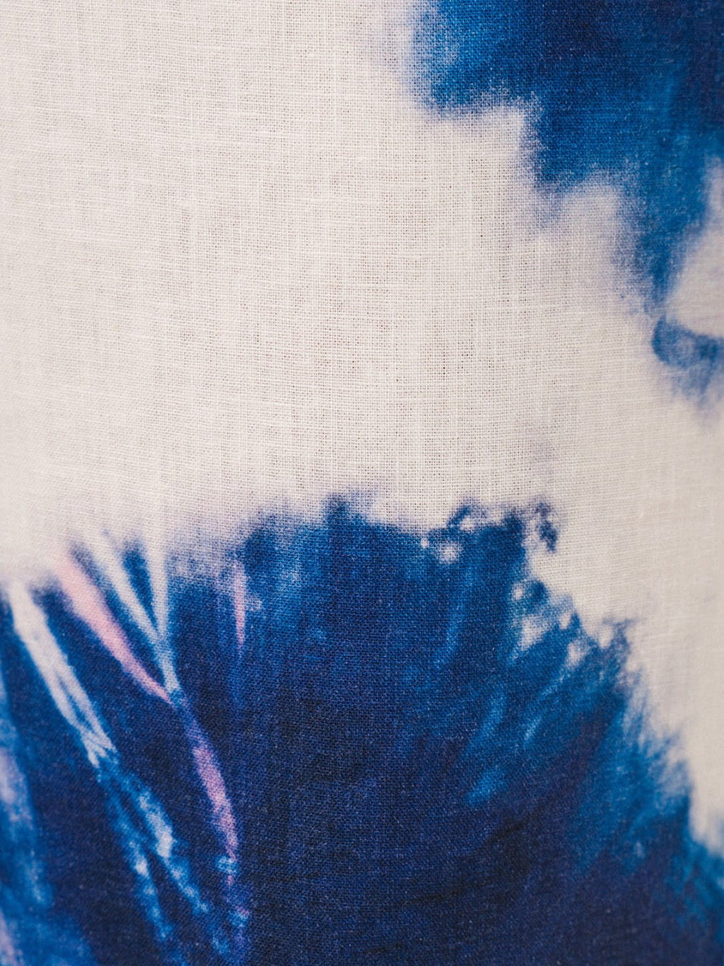 Close-up of tie-dye fabric with blue and white patterns