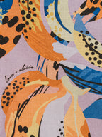 Colorful abstract pattern with bananas on a purple background, featuring the brand 'love + alicia'.