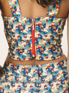 Colorful swimsuit with toucan pattern on a white background