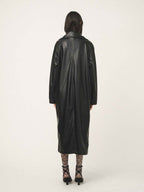 Person wearing a black leather coat on a white background