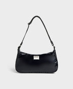 Black handbag with a visible brand logo on a light gray background