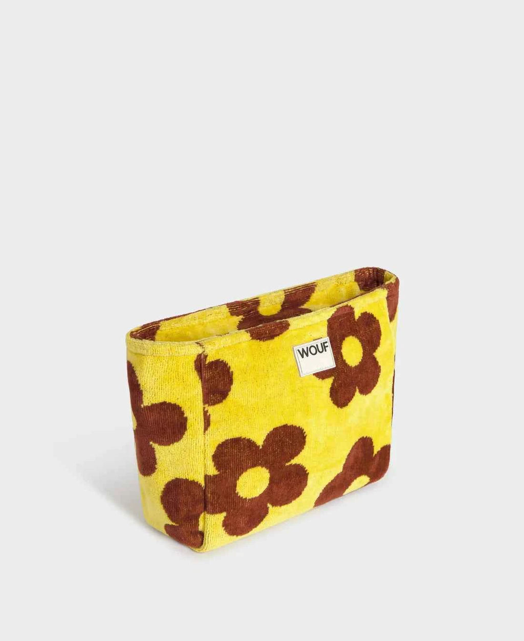 Yellow pouch with brown floral pattern on a white background