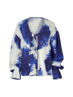 A women's long-sleeve tie-dye cardigan in blue and white, featuring a V-neckline, front tie closures, and front patch pockets, shown against a plain white background.