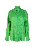 Green patterned shirt on a white background
