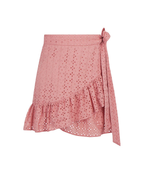 A pink eyelet wrap mini skirt with a side tie and ruffled hem, shown against a plain white background.