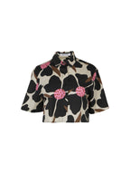 Floral patterned blouse with pink flowers on a white background