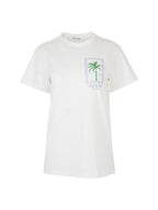 A white short-sleeve crewneck t-shirt featuring a green palm tree graphic inside a light blue rectangular border on the left chest, with 'LOVE AND ALICIA' printed below it.