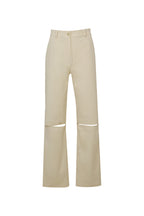 Beige pants with cut-out design on a white background